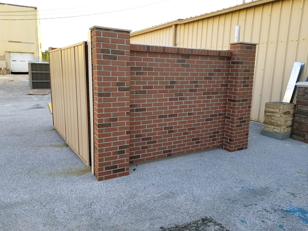 Brick Enclosure with Metal Gates and Brick Columns