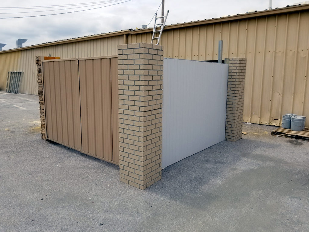 Metal Enclosure with Metal Gates and Brick Columns